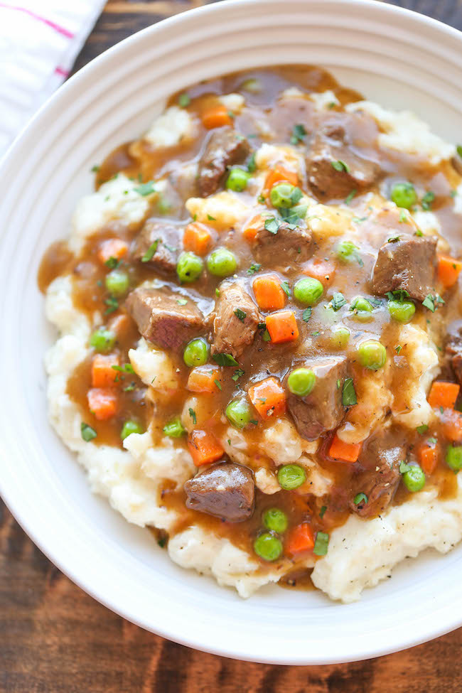 Irish Beef Stew - Amazingly slow-cooked tender beef with garlic mashed potatoes - comfort food at its best, and something you'll want all year long!