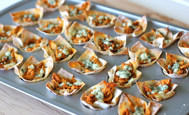 Buffalo Chicken Cups - Crisp oven-baked wonton cups loaded with buffalo chicken and blue cheese!