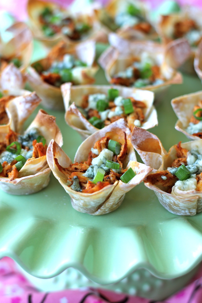 Buffalo Chicken Cups - Crisp oven-baked wonton cups loaded with buffalo chicken and blue cheese!