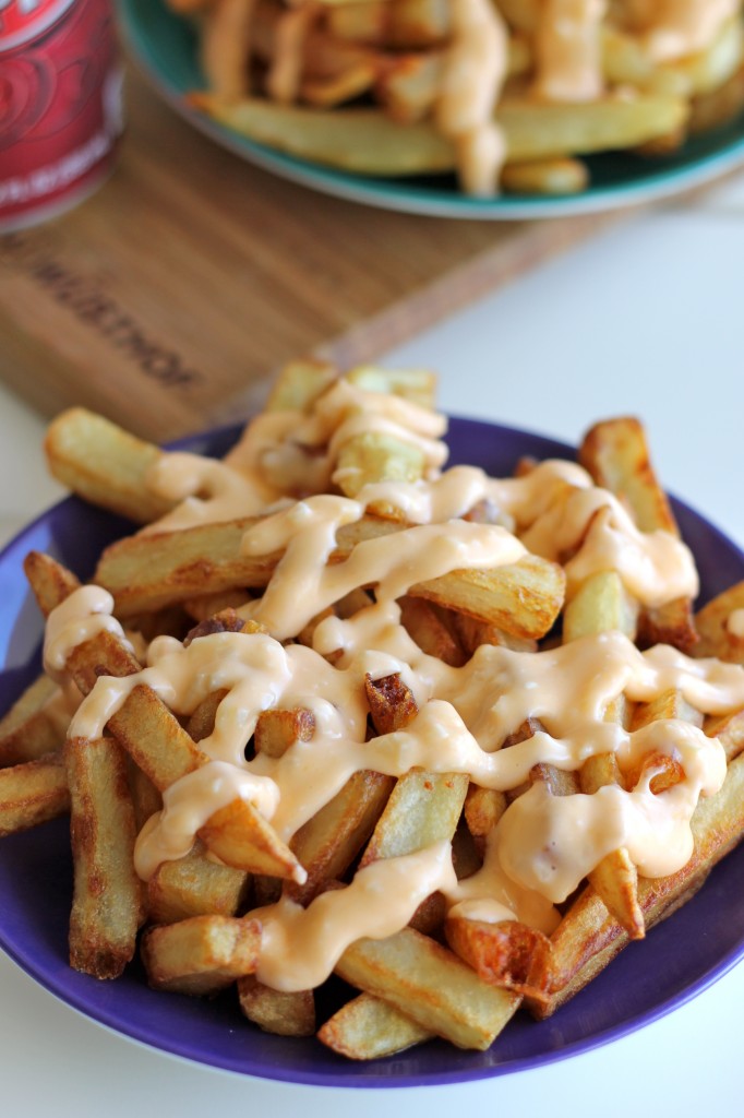 Garlic Cheese Fries - Perfectly double-fried french fries smothered in a garlic cheese sauce that can be made in 5 minutes!