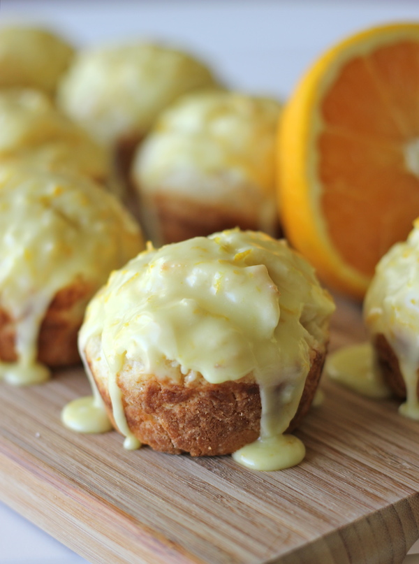 Orange Sour Cream Muffins with Zesty Orange Glaze - Start your mornings off right with these refreshing muffins with a decadent glaze!