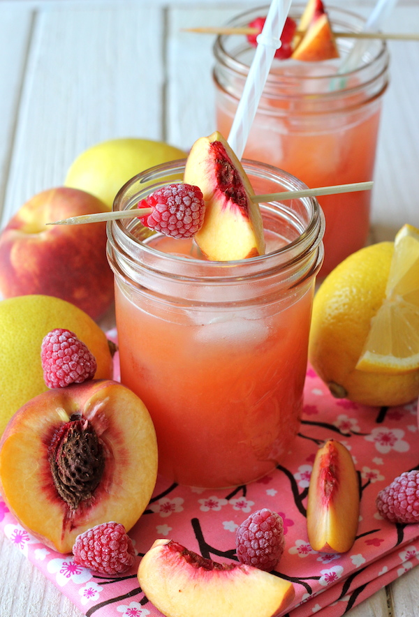 Raspberry Peach Lemonade - Fresh raspberries and peaches add such a wonderfully fruity flavor in this refreshing drink!