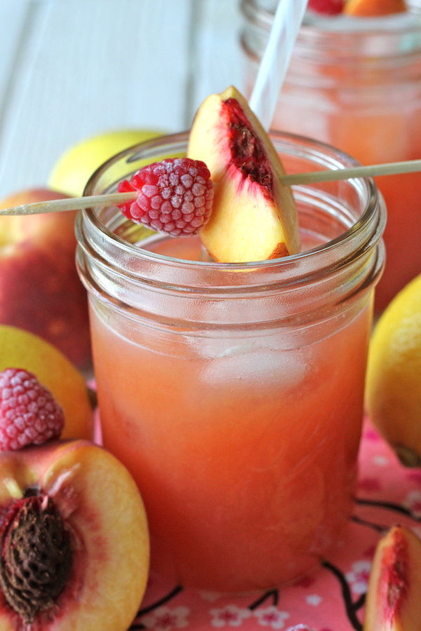 Raspberry Peach Lemonade - Fresh raspberries and peaches add such a wonderfully fruity flavor in this refreshing drink!