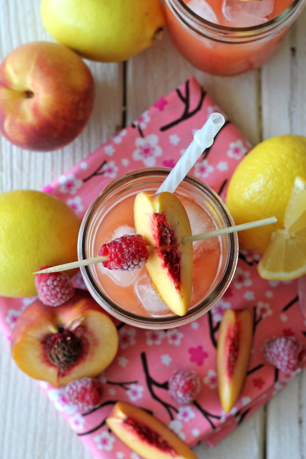 Raspberry Peach Lemonade - Fresh raspberries and peaches add such a wonderfully fruity flavor in this refreshing drink!