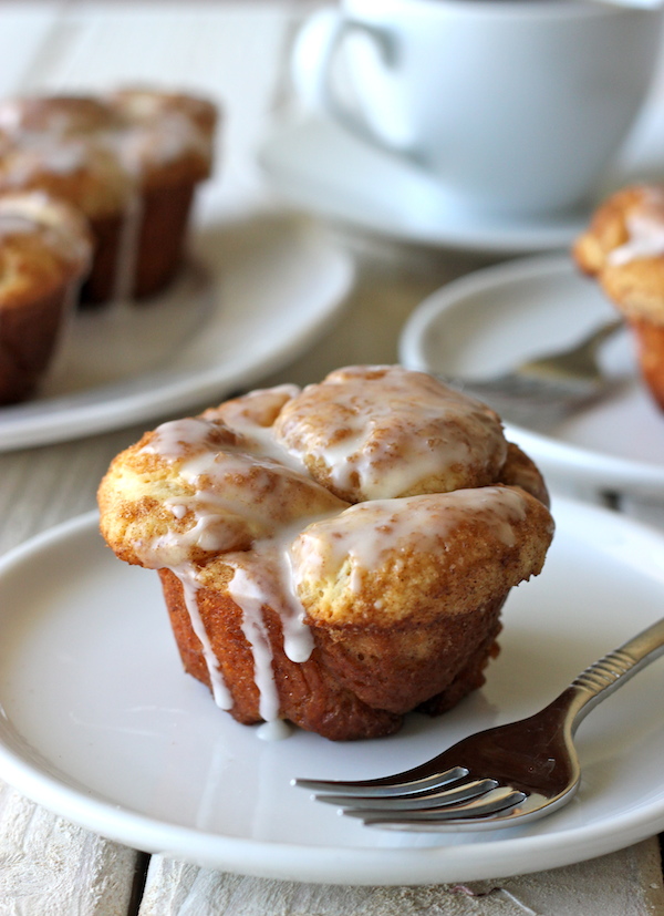 Monkey Bread Cupcakes - Classic monkey bread in irresistible cupcake form oozing with cinnamon sugar goodness and a dripping vanilla glaze!