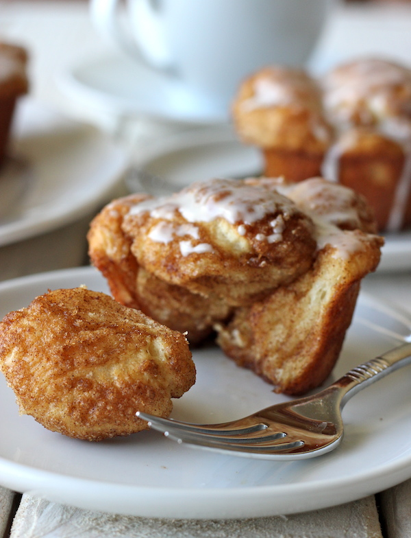 Monkey Bread Cupcakes - Classic monkey bread in irresistible cupcake form oozing with cinnamon sugar goodness and a dripping vanilla glaze!