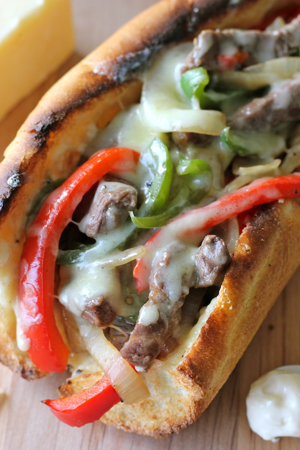 Philly Cheesesteak with Garlic Aioli - You could EASILY make this right at home without having to skimp on the cheesy, meaty goodness!