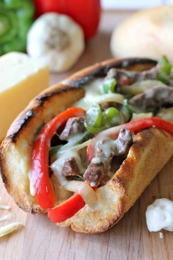 Philly Cheesesteak with Garlic Aioli - You could EASILY make this right at home without having to skimp on the cheesy, meaty goodness!
