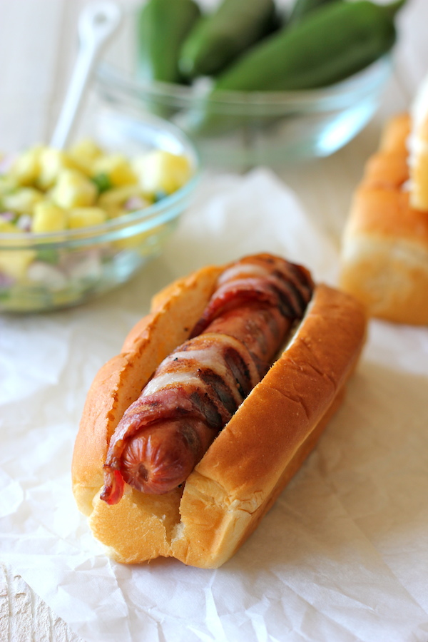 Bacon Wrapped Teriyaki Hot Dogs with Pineapple Salsa - A combination of crisp bacon, a refreshing salsa and a sweet teriyaki drizzle!