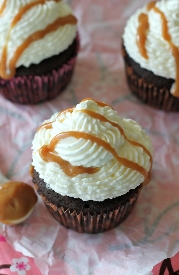 Pumpkin Mocha Cupcakes - These indulgent cupcakes are topped with whipped cream frosting and homemade dulce de leche made in the crockpot!
