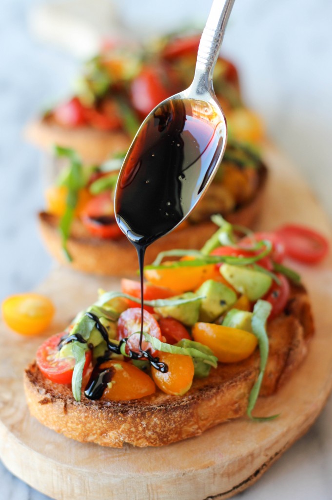 Avocado Bruschetta with Balsamic Reduction - With ripe avocado and juicy grape tomatoes, this is the perfect midday treat or party snack!