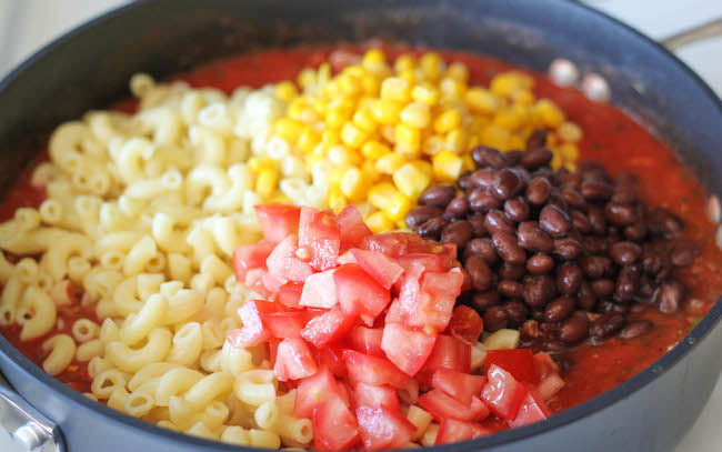 One Pot Mexican Skillet Pasta - This Mexican-inspired pasta dish can be made in 30 minutes or less. Even the pasta gets cooked right in the pot!