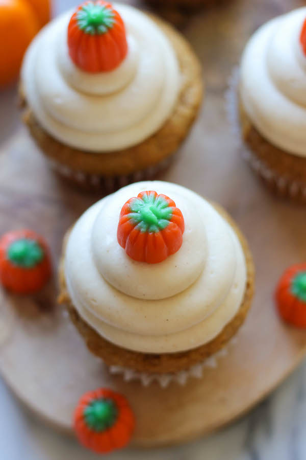 Pumpkin Cupcakes with Cinnamon Cream Cheese Frosting - These cupcakes are light and moist, topped with a fluffy cream cheese frosting!