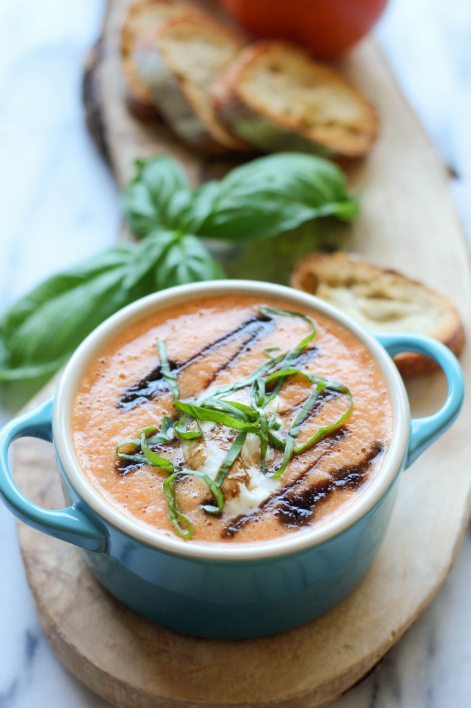 Caprese Tomato Soup - Served caprese-style with burrata, balsamic reduction, and fresh basil leaves!