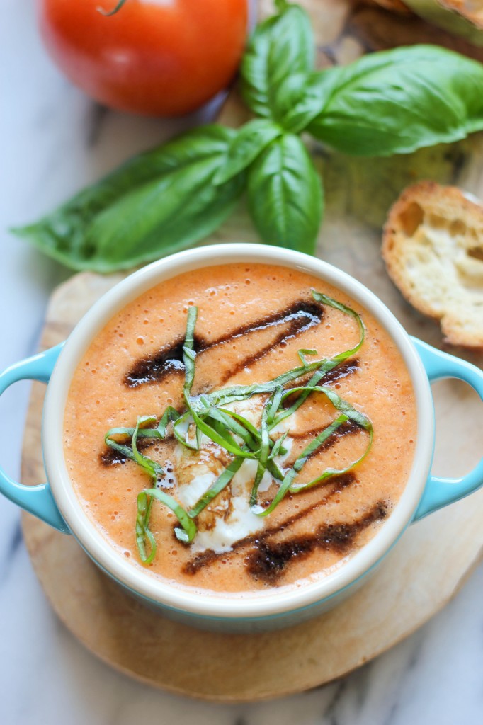 Caprese Tomato Soup - Served caprese-style with burrata, balsamic reduction, and fresh basil leaves!