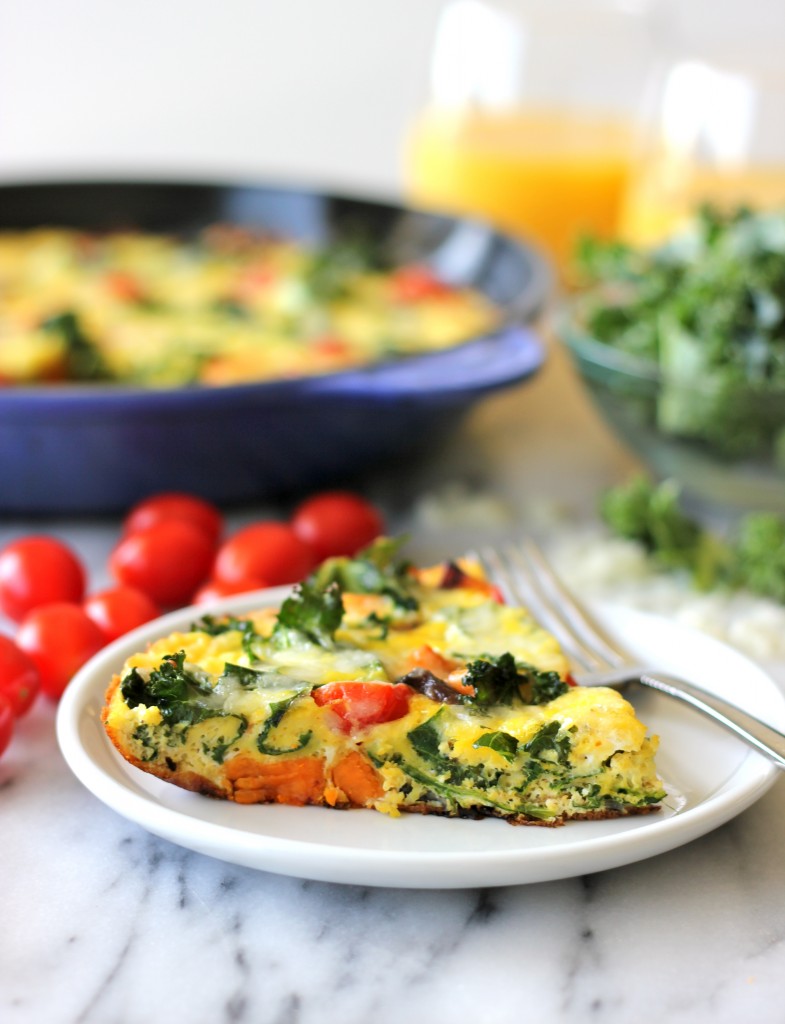 Sweet Potato Kale Frittata - Loaded with caramelized onions, tomatoes, kale and sweet potato goodness topped with melted mozzarella!