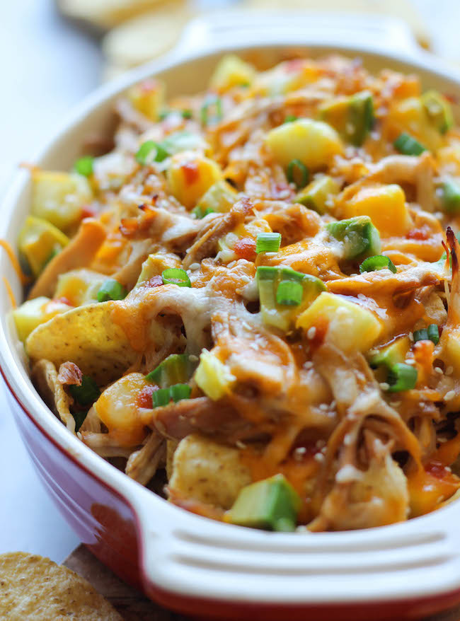 Asian Style Nachos - Loaded with leftover chicken teriyaki, fresh pineapple and spicy Sriracha, the whole family will be begging for more!
