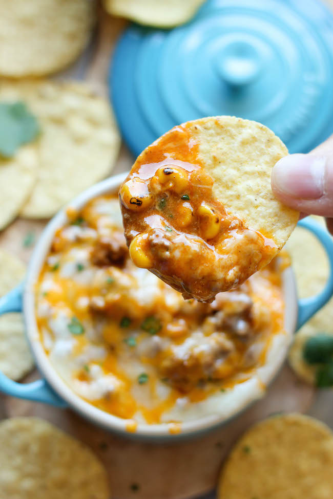 Beef Enchilada Dip - This meaty, cheesy enchilada dip comes together in just 15 minutes, and is the perfect crowd pleasing appetizer!