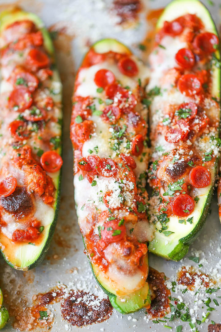Pizza Stuffed Zucchini Boats - All the flavors of pizza neatly packed in healthy, nutritious zucchini boats! It's cheesy comfort without any of the guilt!