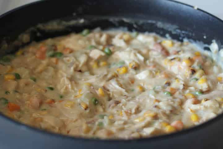 Leftover turkey pieces mixed into the Thanksgiving Turkey Pot Pie filling.