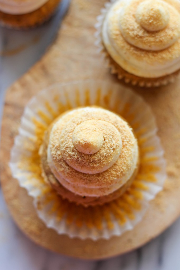 Pumpkin Cheesecake Cupcakes - With a surprise cheesecake filling and graham cracker crumb topping, these are sure to impress your guests!