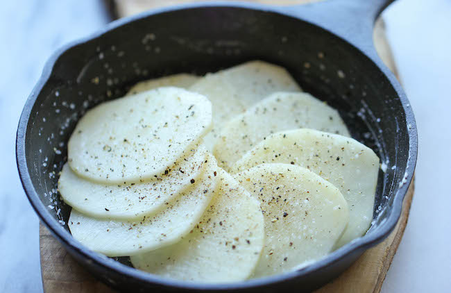 Parmesan Crusted Scalloped Potatoes - Rich, creamy, and cheesy potatoes smothered in heavy cream and Parmesan goodness!