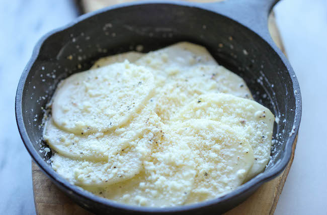 Parmesan Crusted Scalloped Potatoes - Rich, creamy, and cheesy potatoes smothered in heavy cream and Parmesan goodness!