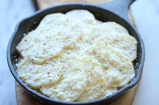Parmesan Crusted Scalloped Potatoes - Rich, creamy, and cheesy potatoes smothered in heavy cream and Parmesan goodness!