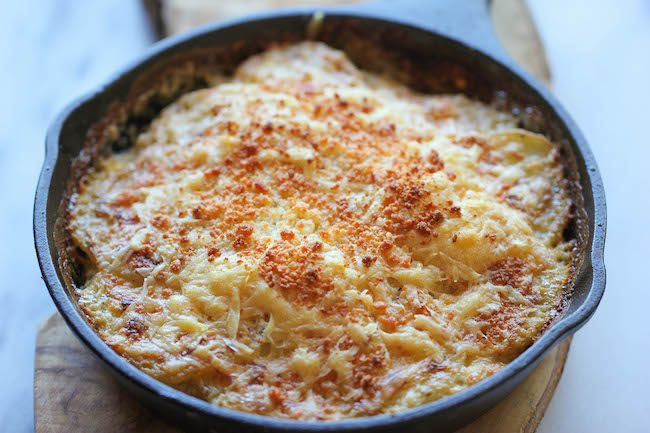 Parmesan Crusted Scalloped Potatoes - Rich, creamy, and cheesy potatoes smothered in heavy cream and Parmesan goodness!