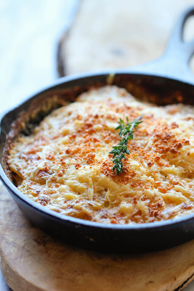 Parmesan Crusted Scalloped Potatoes - Rich, creamy, and cheesy potatoes smothered in heavy cream and Parmesan goodness!