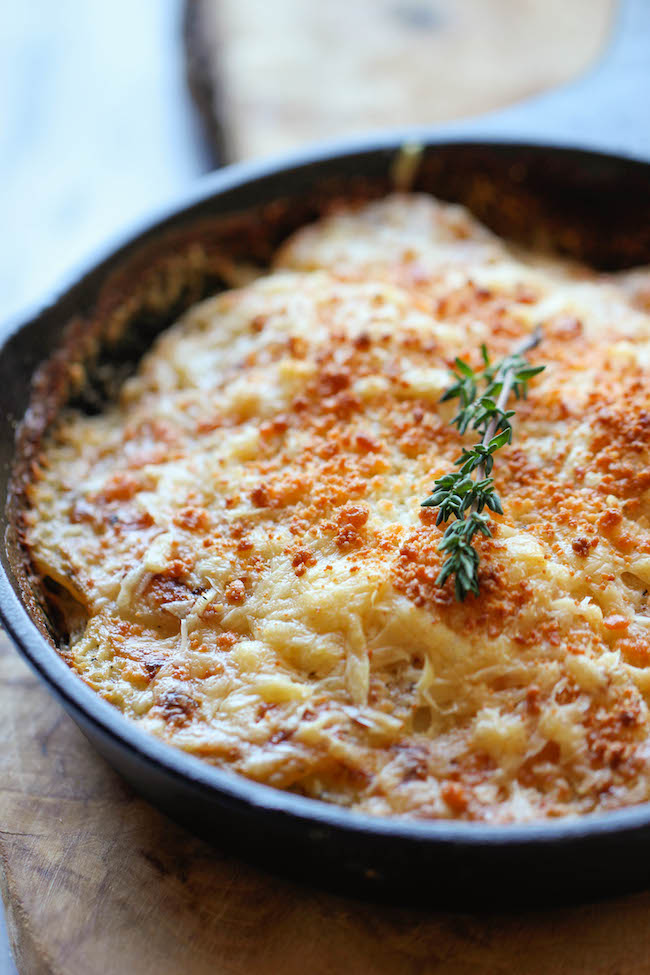 Parmesan Crusted Scalloped Potatoes - Rich, creamy, and cheesy potatoes smothered in heavy cream and Parmesan goodness!