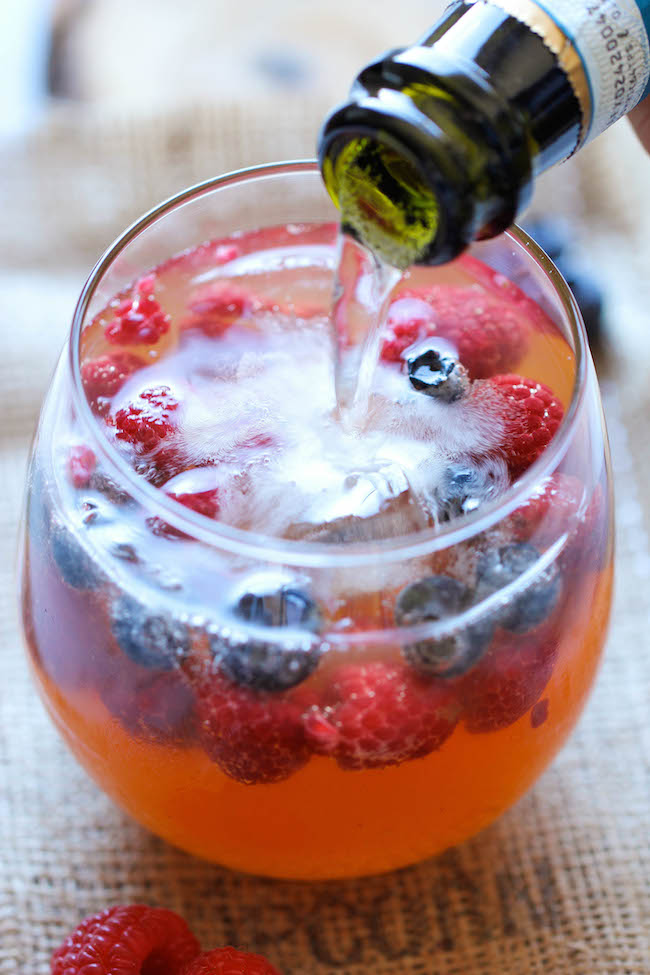 Peach Prosecco Punch - An incredibly refreshing, bubbly party punch made with Prosecco, peach nectar and fresh berries!