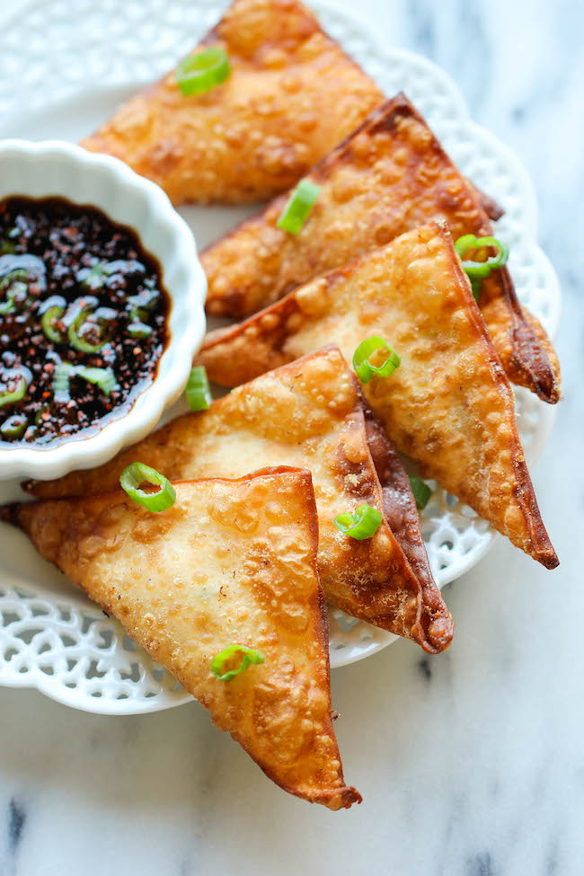Crab Rangoon - This crisp, fried wonton is loaded with cream cheese and crab goodness, and it's an absolute party favorite!