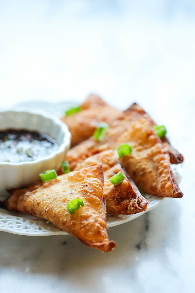 Crab Rangoon - This crisp, fried wonton is loaded with cream cheese and crab goodness, and it's an absolute party favorite!