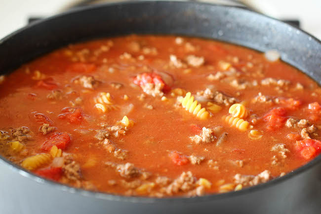 One Pot Cheeseburger Casserole - This cheesy goodness comes together so easily in one skillet. Even the pasta gets cooked right in the pan!