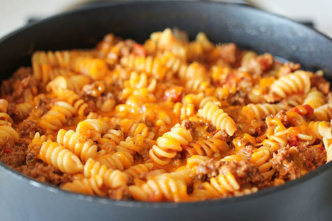 One Pot Cheeseburger Casserole - This cheesy goodness comes together so easily in one skillet. Even the pasta gets cooked right in the pan!