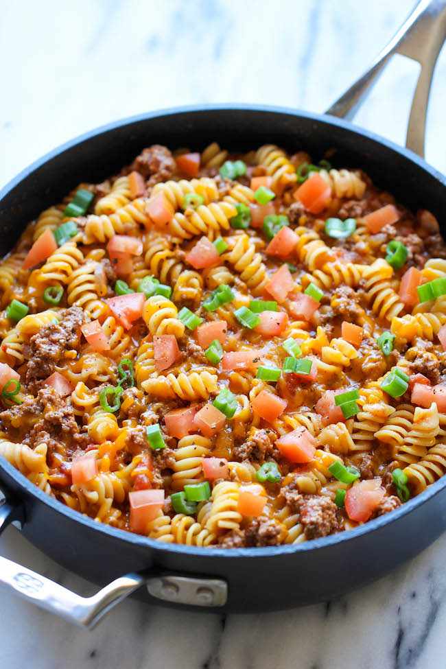 One Pot Cheeseburger Casserole - This cheesy goodness comes together so easily in one skillet. Even the pasta gets cooked right in the pan!