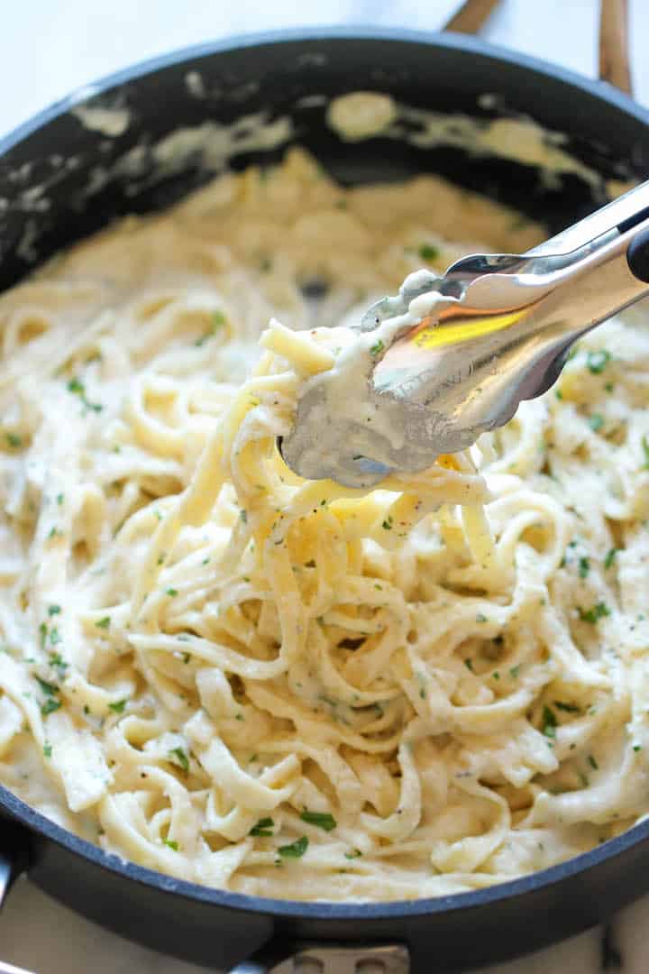 Fettuccine pasta tossed in a creamy, skinny Alfredo sauce and garnished with parsley