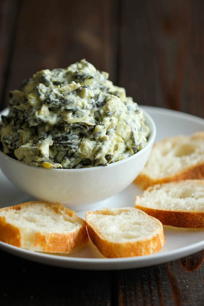 Slow Cooker Spinach and Artichoke Dip - Simply throw everything in the crockpot for the easiest, most effortless spinach and artichoke dip!