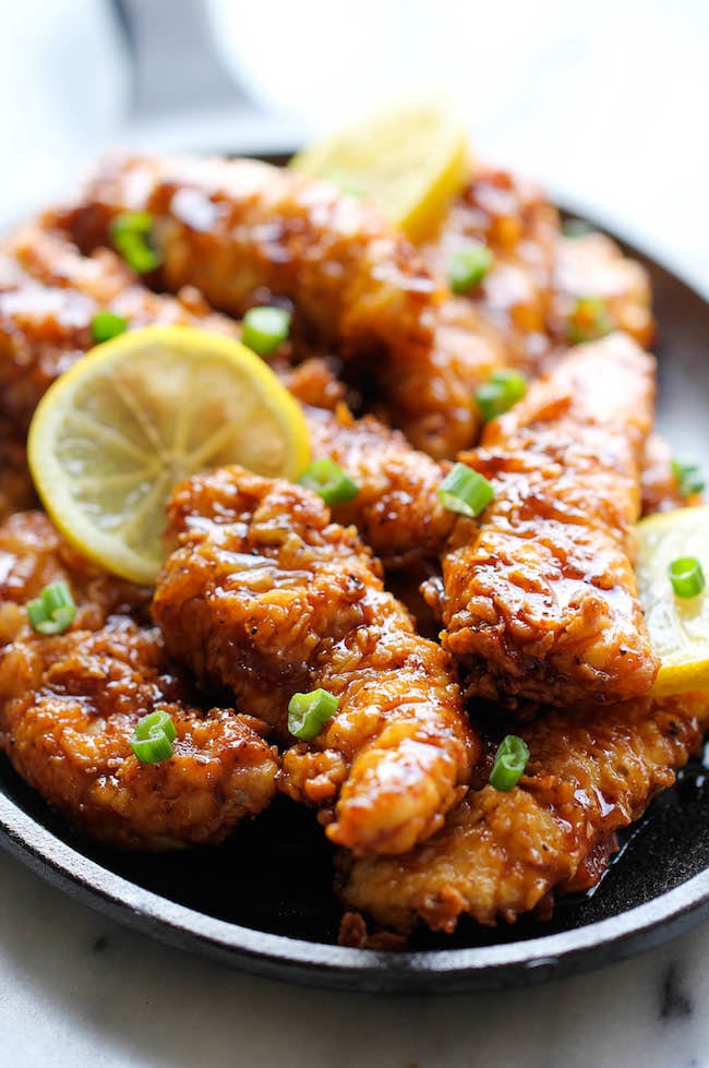 Asian Lemon Chicken Tenders - A wonderful asian twist to your favorite chicken tenders, tossed in the most heavenly sweet, lemon glaze!