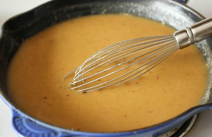 Beef broth and sour cream, seasoned with salt and pepper, to taste.