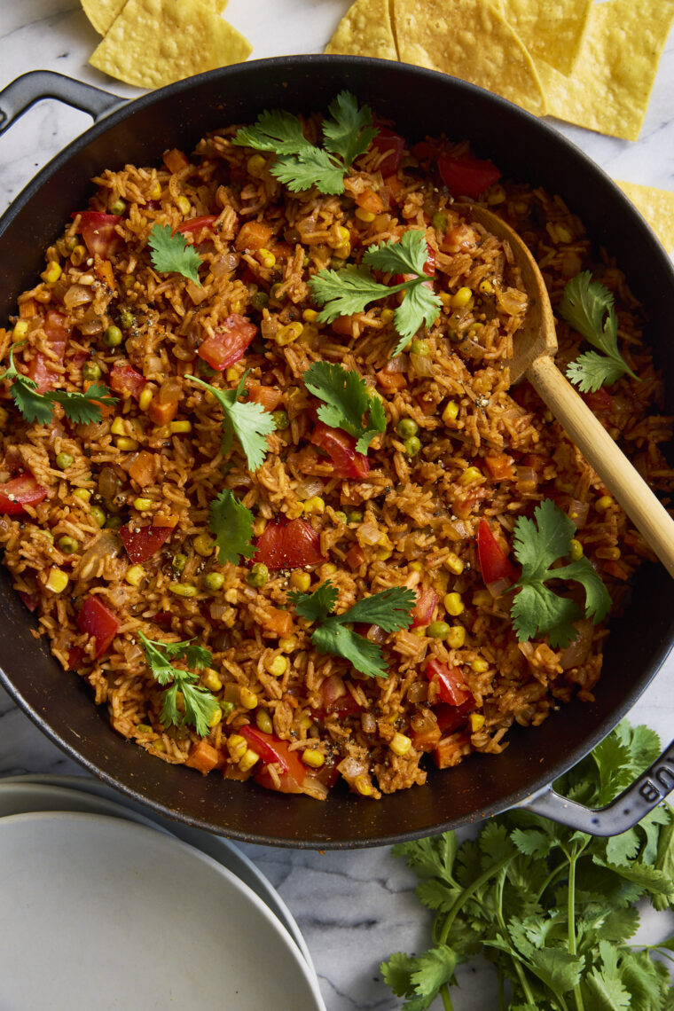 Mexican Rice - Restaurant-style Mexican rice made right at home! The best side dish for tacos, burritos, enchiladas + so much more. So good!