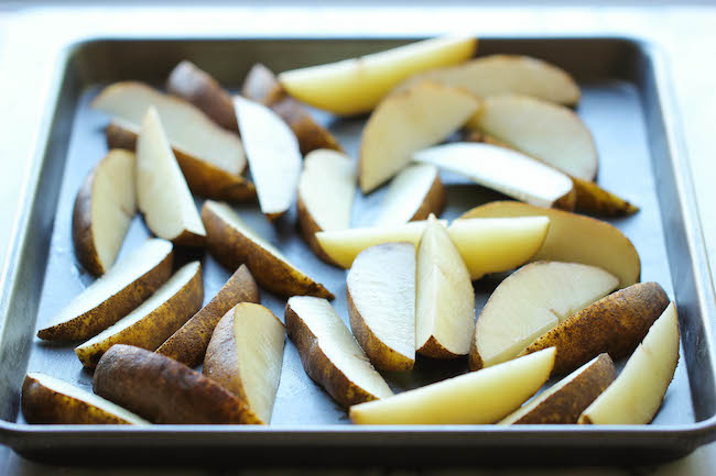 Garlic Parmesan Fries - Amazingly crisp, oven-baked fries coated with freshly grated Parmesan and a generous dose of garlic goodness!