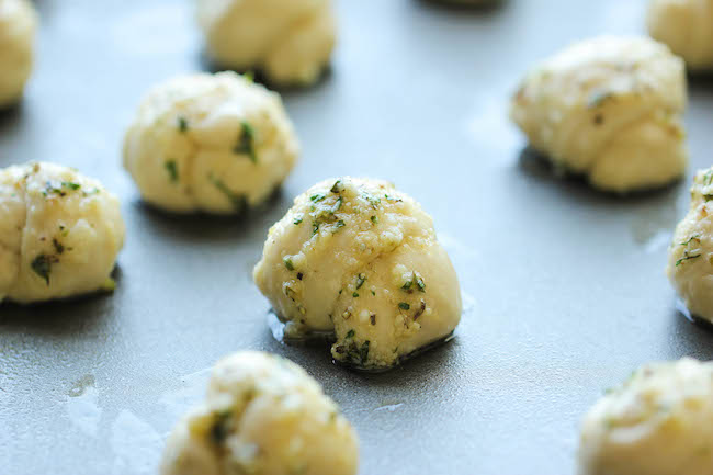 Easy Garlic Parmesan Knots - Fool-proof, buttery garlic knots that come together in less than 20 min - it doesn't get easier than that!