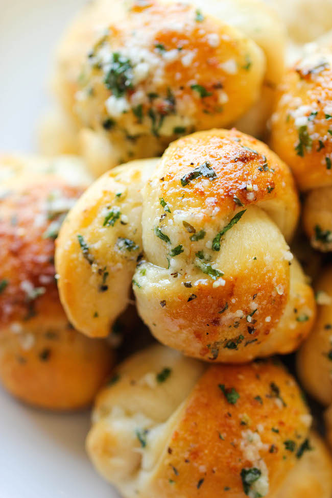 Easy Garlic Parmesan Knots - Fool-proof, buttery garlic knots that come together in less than 20 min - it doesn't get easier than that!