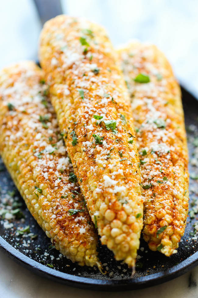 Mexican Corn on the Cob - This is the best way to serve corn, brushed with melted butter and sprinkled with chili powder, cheese and lime!