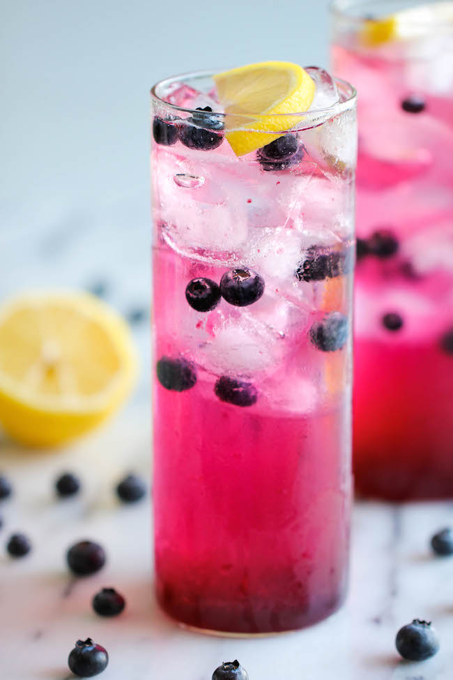 Blueberry Lemonade - Made with an easy blueberry syrup, this lemonade is so refreshing, sweet and tangy! It's the perfect way to cool down on a hot day!