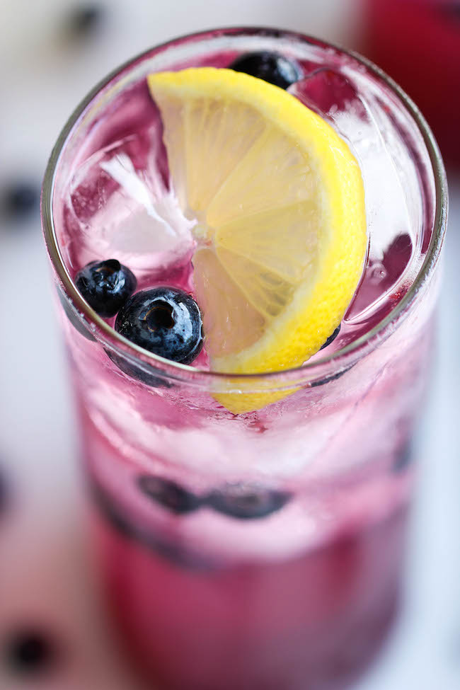 Blueberry Lemonade - Made with an easy blueberry syrup, this lemonade is so refreshing, sweet and tangy! It's the perfect way to cool down on a hot day!