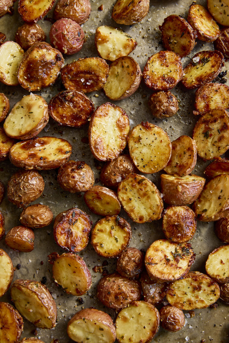 Garlic Parmesan Roasted Potatoes - Perfectly crisp-tender garlicky, buttery roasted potatoes. The most perfect side dish for all your meals!