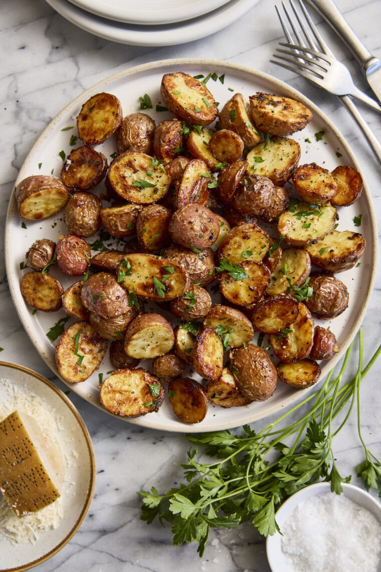 Garlic Parmesan Roasted Potatoes - Perfectly crisp-tender garlicky, buttery roasted potatoes. The most perfect side dish for all your meals!